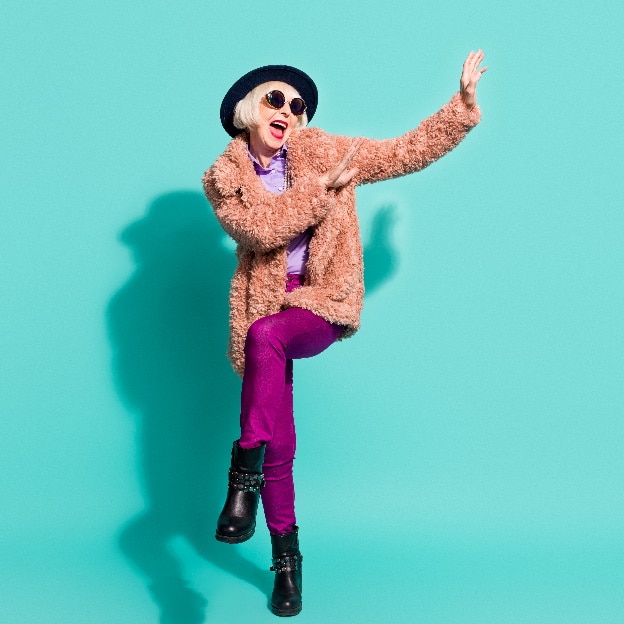 Photo of adorable cute old woman dressed vintage outerwear cap eyewear dancing isolated turquoise color background featured photo
