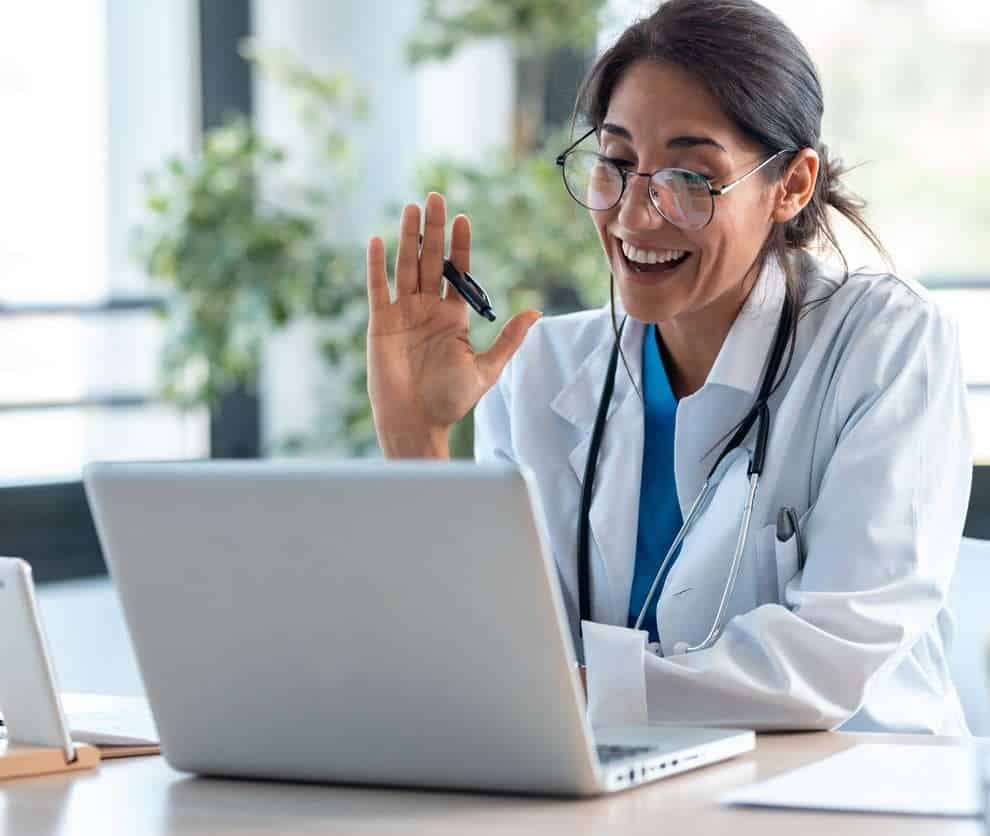 Doctor looking at her laptop